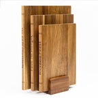 Original acacia book-shaped cutting boards upright with base