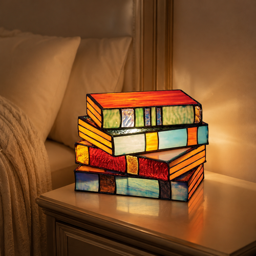 Book LED Table Lamp glowing on a premium bedside table
