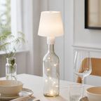 White cylinder bottle lamp on a dining table