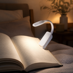 White clip-on reading light in a bedroom