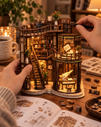 Dreamy Book Hall close-up building process with hands placing miniature details