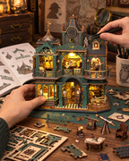 Green Detective Agency miniature being assembled by hand with tools and instructions
