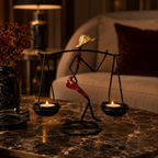 Sculptural Figure Candle Holder with lit tealights on a marble table
