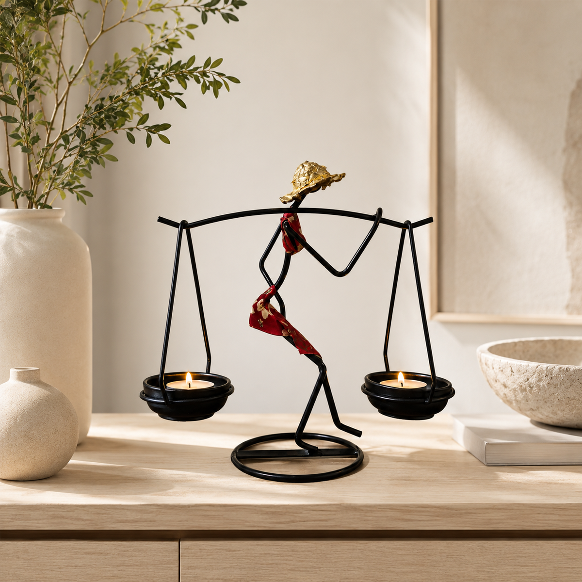 Sculptural Figure Candle Holder with lit tealights in an elegant evening setting
