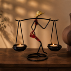 Sculptural Figure Candle Holder with lit tealight candles in a warm interior