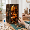 DIY Vintage Tailor Shop Book Nook on a craft table with assembly parts and instructions