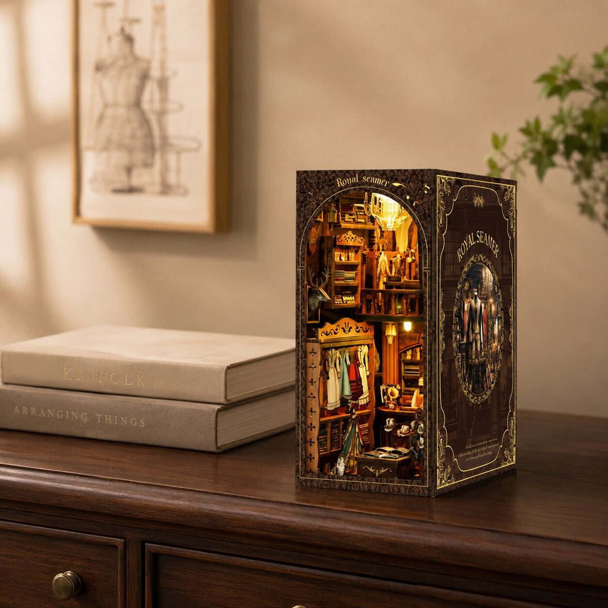 Vintage Tailor Shop book nook displayed on a dark wood living room console